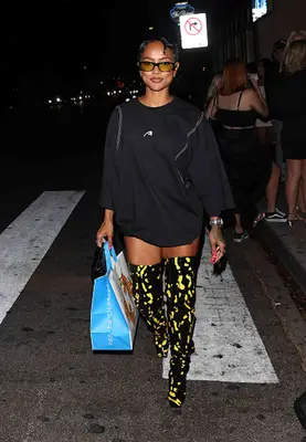 woman wearing over the knee boots and mini dress