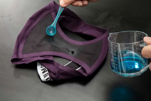 Side-by-side selection of three different pairs of period underwear we recommend on a silk background