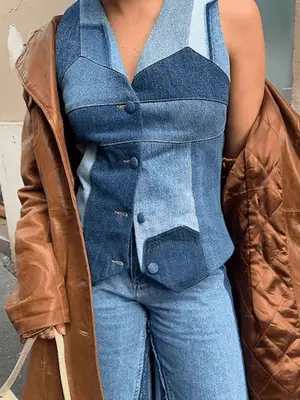 Yara Shahidi wears a denim corset top, jeans, and jacket