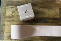 The Kmboobies Boob Tape roll below its box