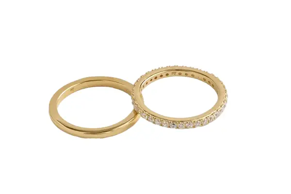 A woman wearing the Urban Outfitters Statement Metal Gold Bangle