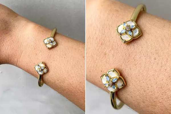 A person wearing the Kendra Scott Gold Bracelet with Gemstones