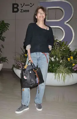 Jane Birkin with her decorated Birkin bag