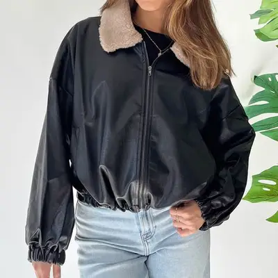 Grey Bandit Arlo Jacket dark leather bomber with light brown shearling collar on model styled with jeans