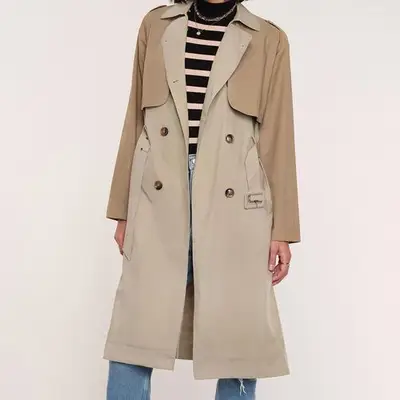 Heartloom Lucena Trench in khaki on model styled with striped sweater and jeans