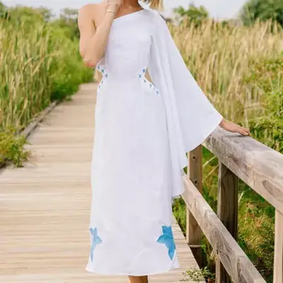 White linen pants with an elastic waistband styled in a straight-leg fit