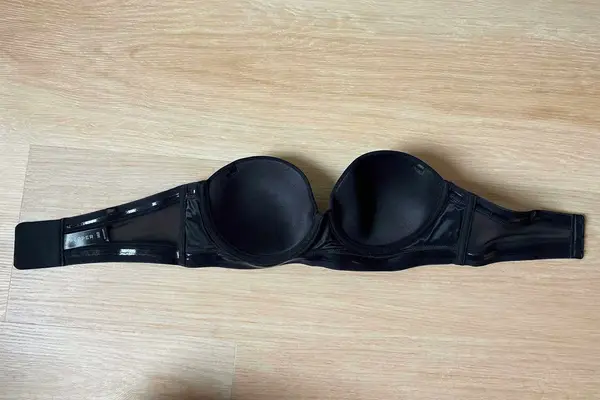 Back of the Pepper MVP Multiway Strapless Bra displayed on a wood floor