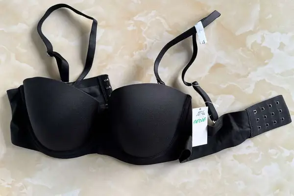 Aerie Real Sunnie Strapless Lightly Lined Bra with straps displayed on a beige surface 