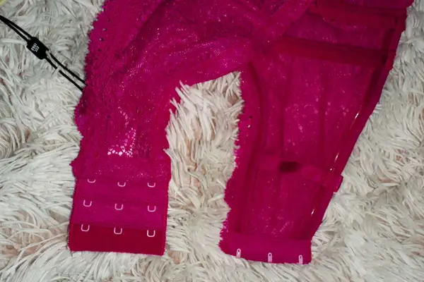 Closeup of Cosabella Forte Convertible Strapless Bra straps and hooks displayed on a furry blanket