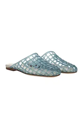 A pair of Vince jelly shoes set against a white background.