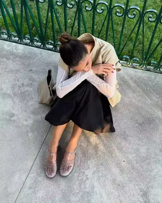 model wearing pink jelly shoes