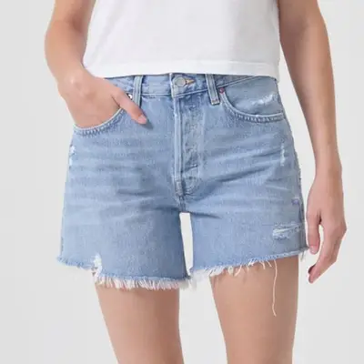 Agolde Parker Long Short in light wash denim on model styled with white shirt