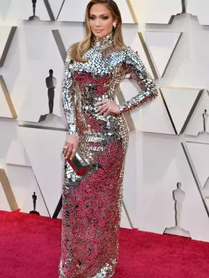 Jennifer Lopez wears a mirrored high neck Tom Ford gown to the 2019 Oscars