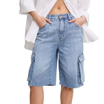 Good American Denim Cargo Shorts on model styled with white shirt