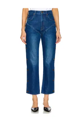 Tanner Addell poses while wearing western denim shorts.