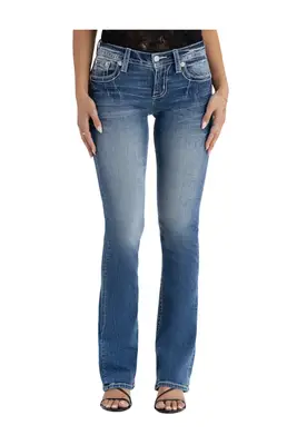 Devon Lee Carlson poses while wearing western denim.