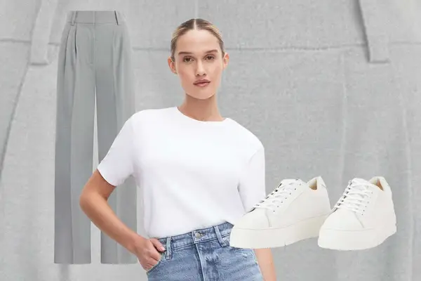 Gray trousers, white t-shirt and light wash jeans on model, and off-white sneakers