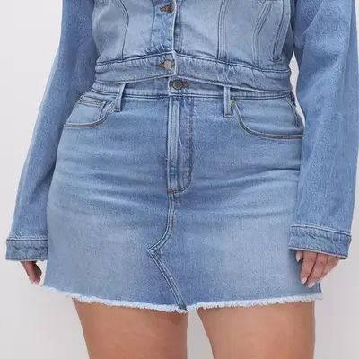 Good American Denim Mini Skirt in light wash indigo on model