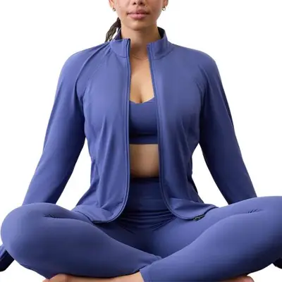 model wearing purple Athleta jacket