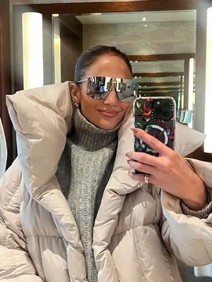 We Norwegians + Inuikii Merino Wool Blend Pique Jumpsuit in black, white, and red