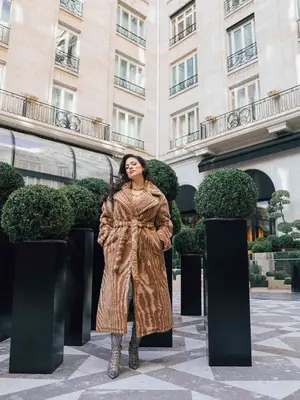 Woman wearing cashmere cream v-neck sweater