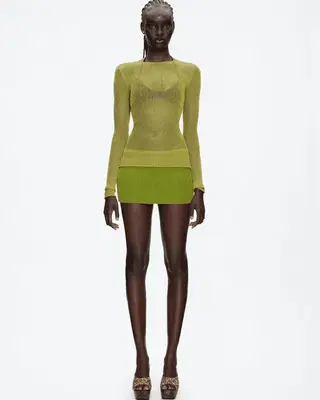 model wearing a green mesh set