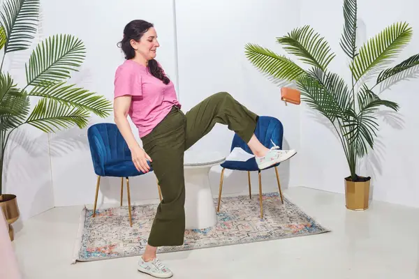 a woman kicks the Levenger Carrie Mini Jewelry Organizer during testing