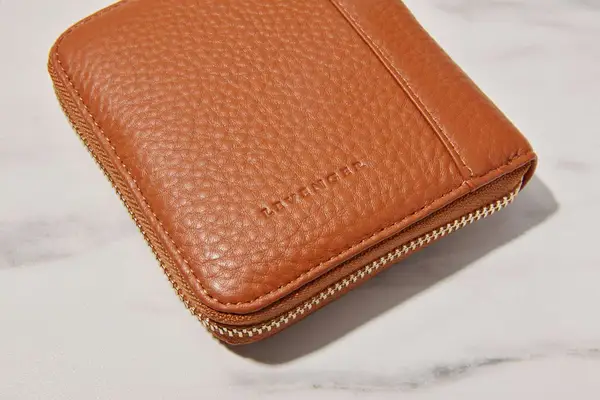 A closed Levenger Carrie Mini Jewelry Organizer on a marble background