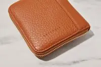 A closed Levenger Carrie Mini Jewelry Organizer on a marble background