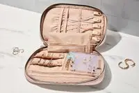 An open Bagsmart Jewelry Organizer Bag filled with jewelry