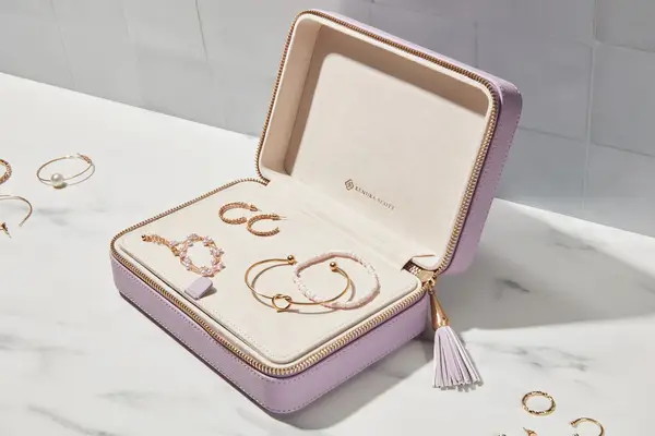 An open Kendra Scott Medium Travel Jewelry Case filled with jewelry