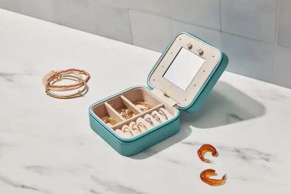 A Vee & Co. Small Travel Jewelry Case lying open on a counter