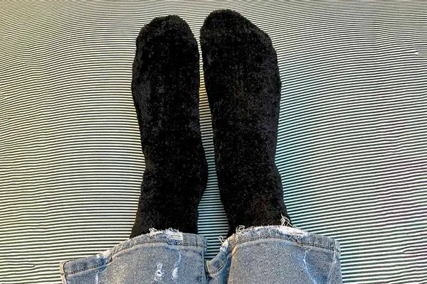 A person wearing the UGG Leda Cozy Socks