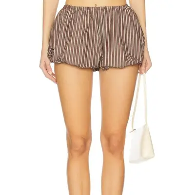 model wearing striped brown shorts