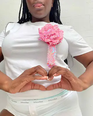 model wearing pink prize ribbon