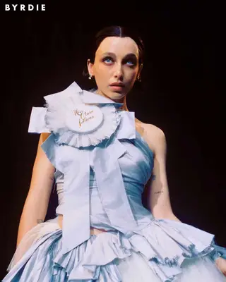 Emma Chamberlain wearing a blue prize ribbon dress