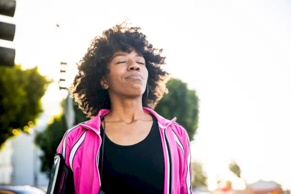 Young Fit Woman Listening to Music