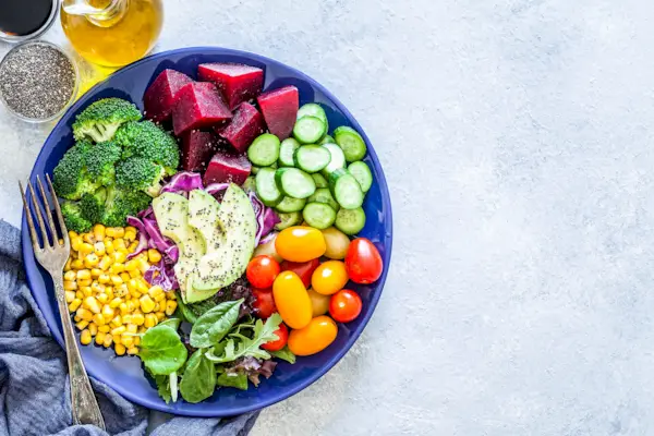 Salad mix plate shot from above on light gray marble table
