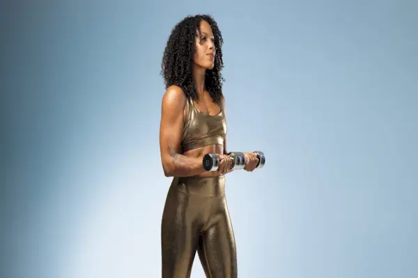 Personal trainer nellie barnett holding dumbbells, demonstrating how to find the right weight 