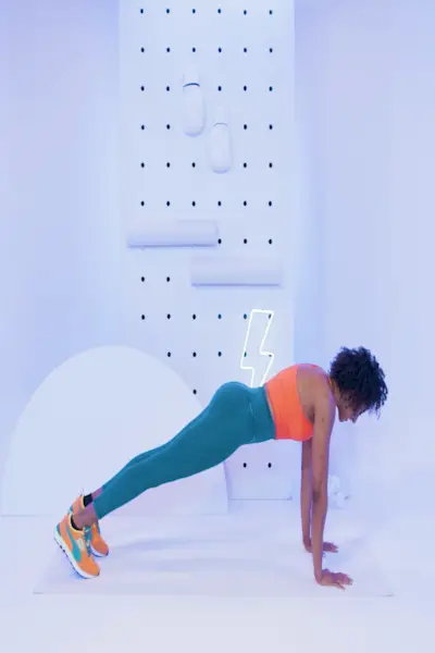 African woman doing stretching at home