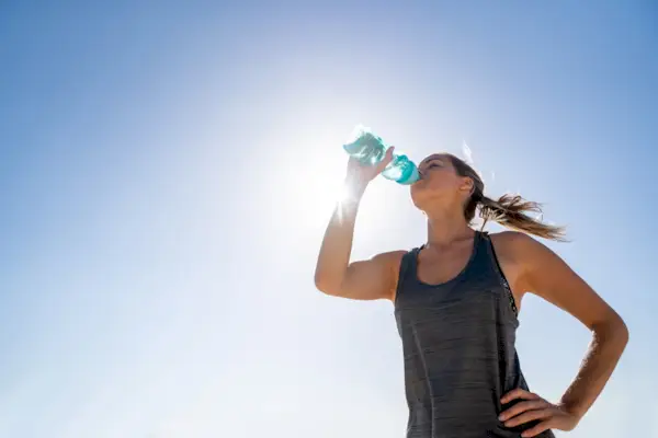 Happy woman feeding female friend