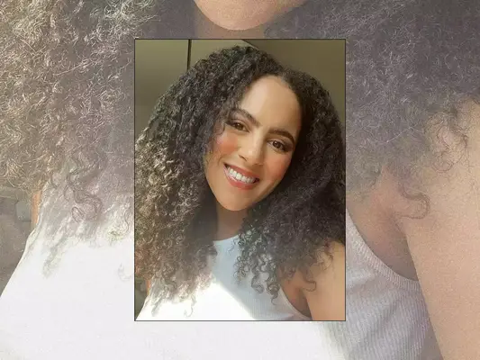 MYM Beauty editor Star Donaldson with a radiant makeup look and white tank top