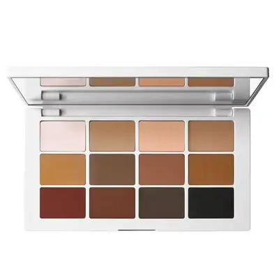 Eye shadow palette open with 12 different colors of brown, tan, and black
