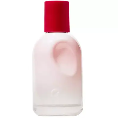 Pink Glossier perfume bottle with a red cap