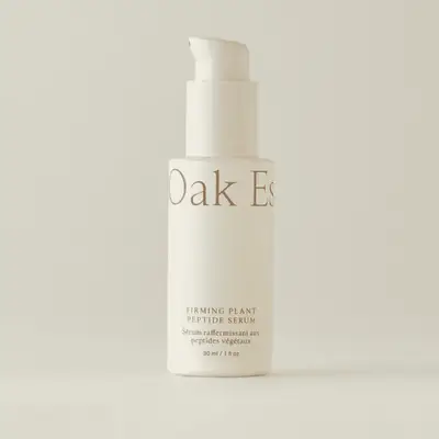 Firming plant peptide serum bottle with a pump dispenser