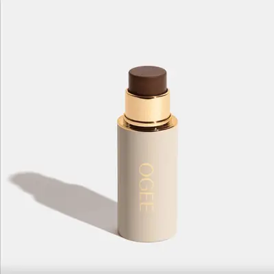 Ogee branded foundation stick with gold accents