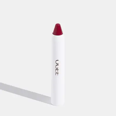 White lipstick tube with red top 