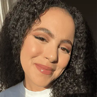 MYM Beauty associate social media director star donaldson wearing juvia