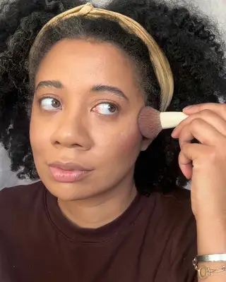 the author blending in her blush and highlight