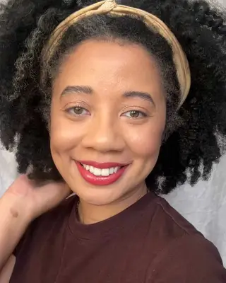 the author wearing the lip combo from SheGlam